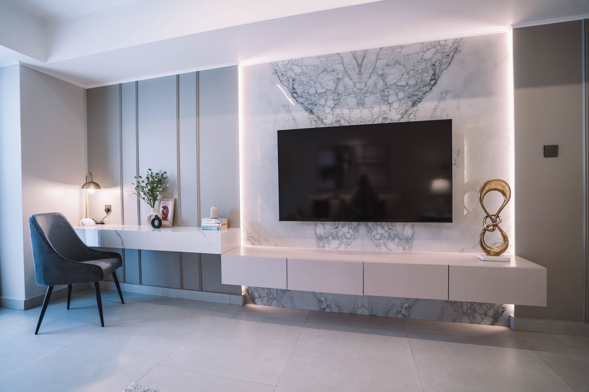 Marble TV wall with a built-in desk