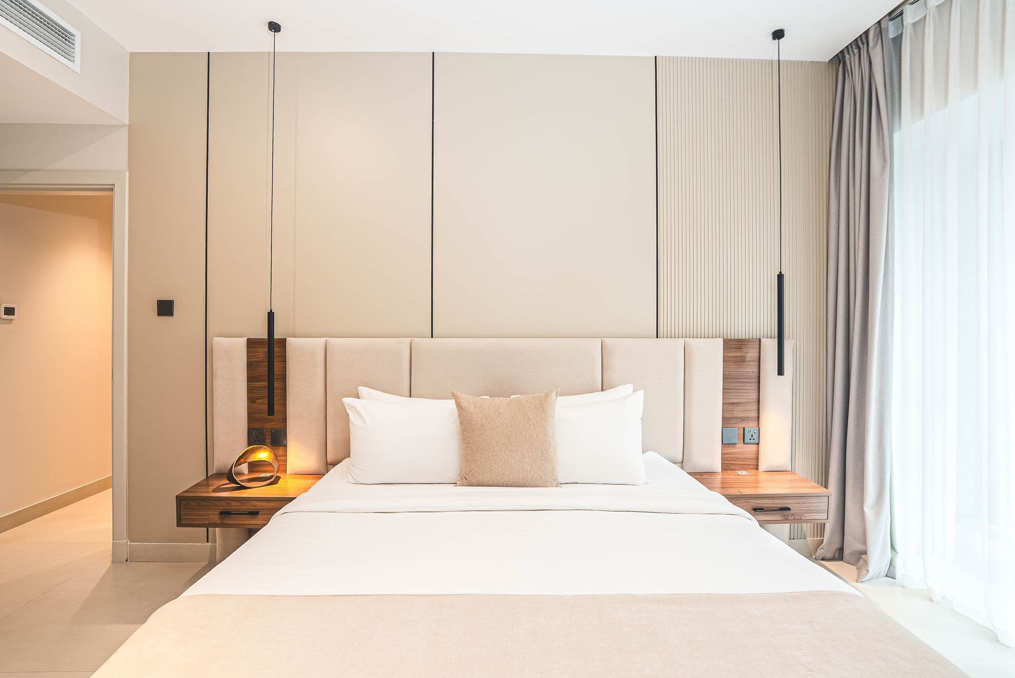 Bedroom with a panelled headboard