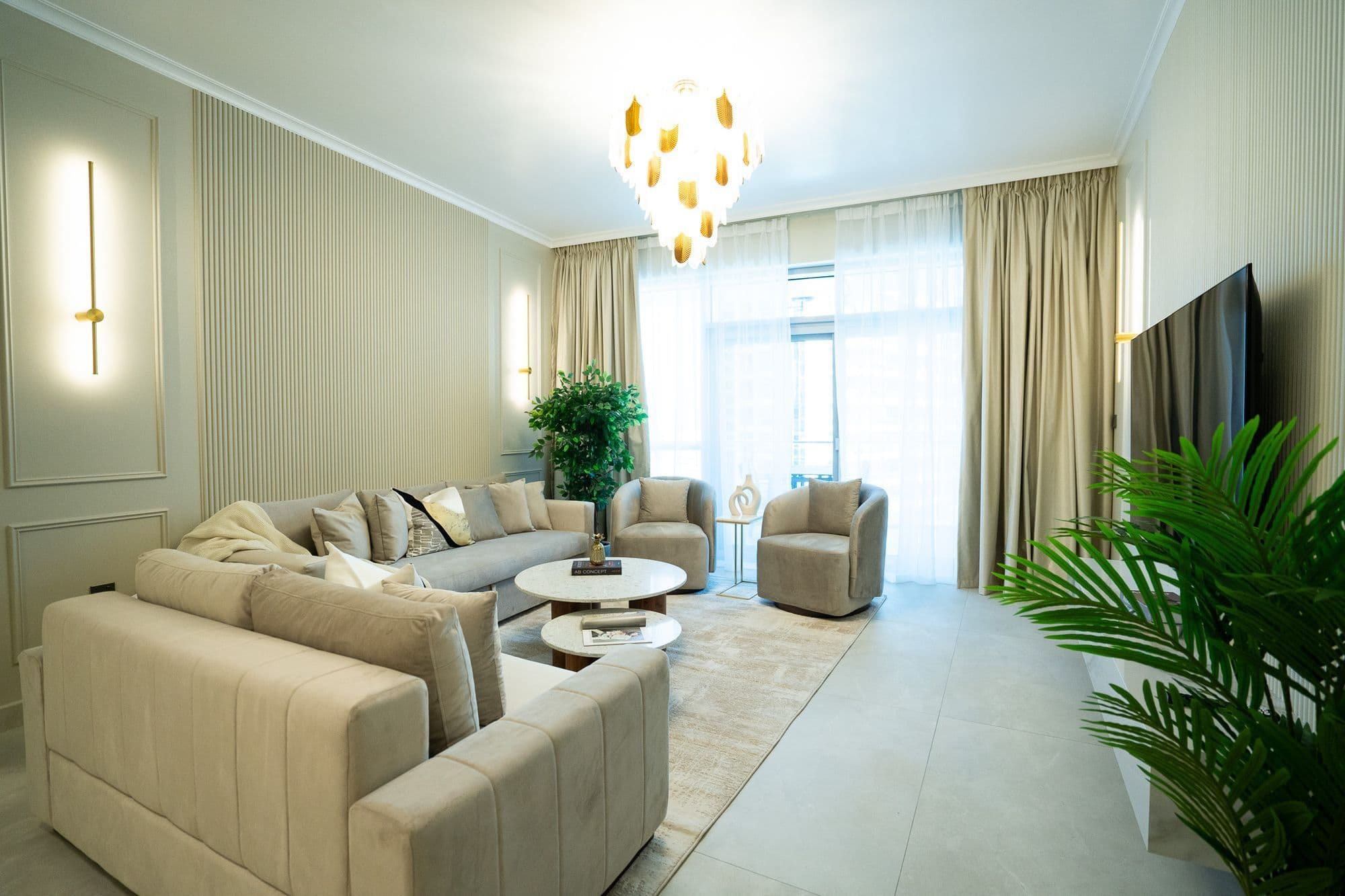 Spacious living room with a chandelier