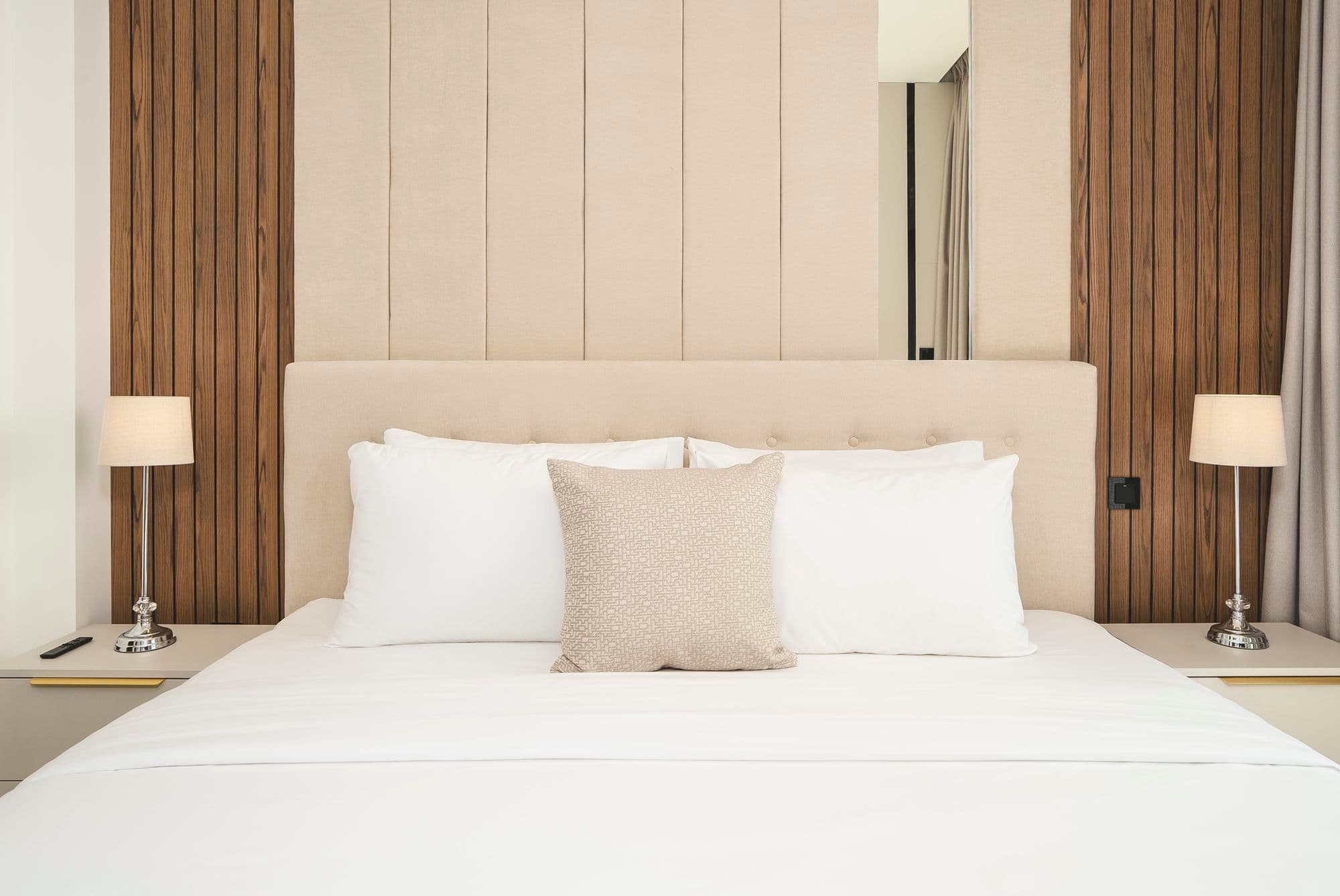 Bedroom with wood-panelled walls