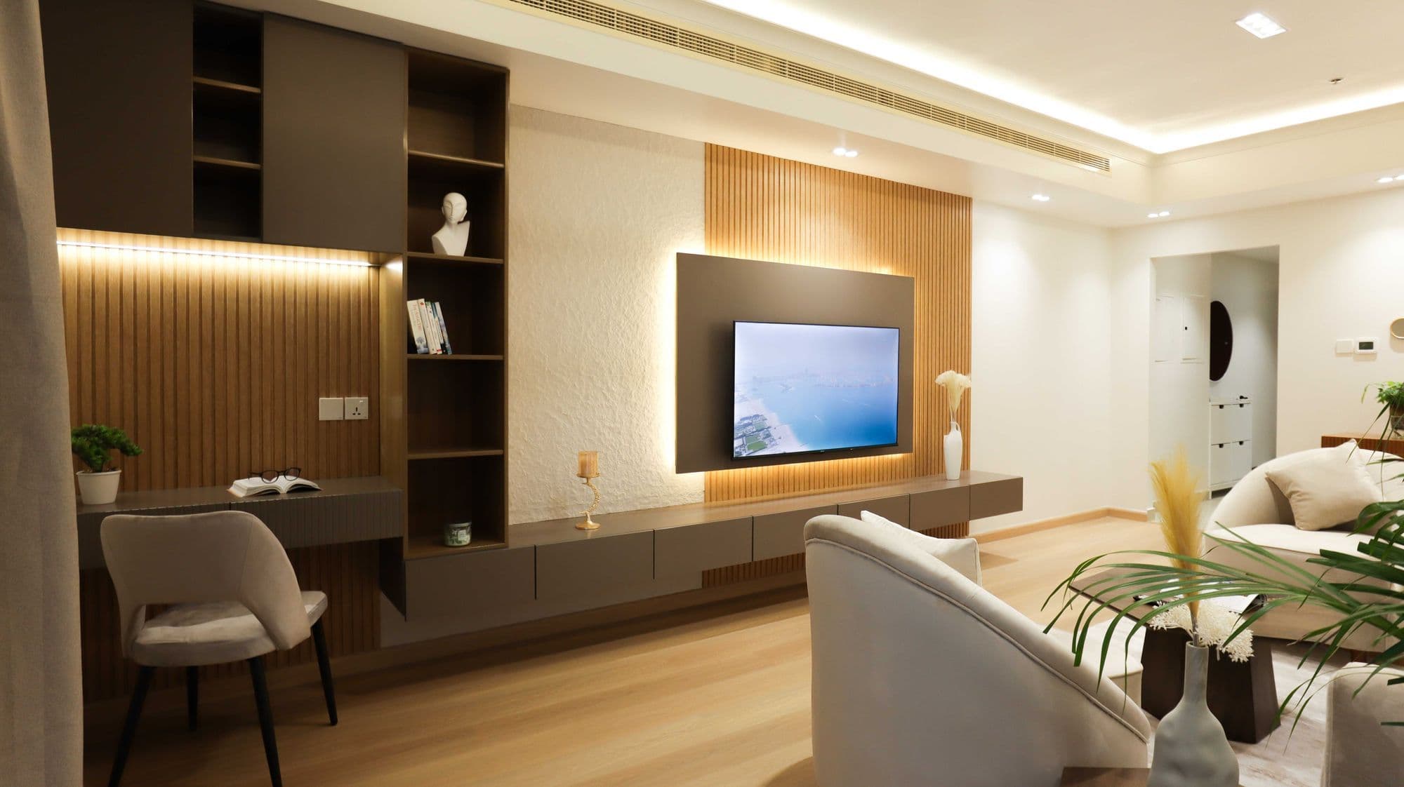 Living room with a wood and stone TV wall